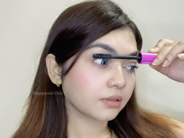 Applying a second coat of tubing mascara for added length